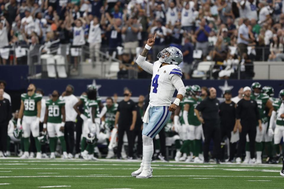 Dallas Cowboys quarterback Dak Prescott reacts after a touchdown in the against the New York Jets at AT&T Stadium.