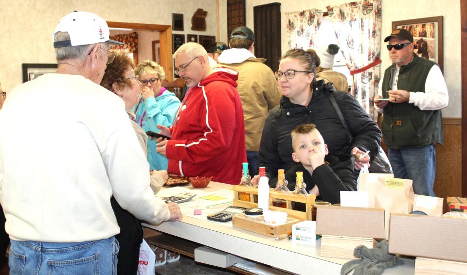 Tourists buy maple products at Milroy Farms in Elk Lick Township during the 2023 Maple Weekend Taste and Tour.