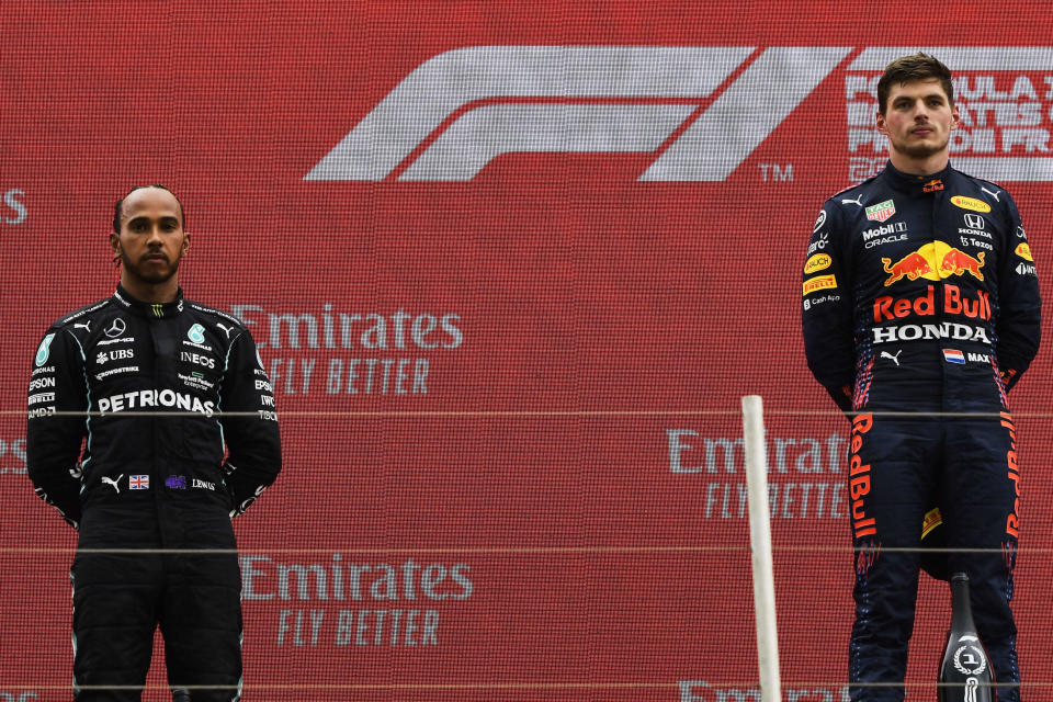 Red Bull driver Max Verstappen of the Netherlands, right, celebrates from the podium after winning the French Formula One Grand Prix next to second place Mercedes driver Lewis Hamilton of Britain, left, at the Paul Ricard racetrack in Le Castellet, southern France, Sunday, June 20, 2021. (Nicolas Tucat/Pool via AP)