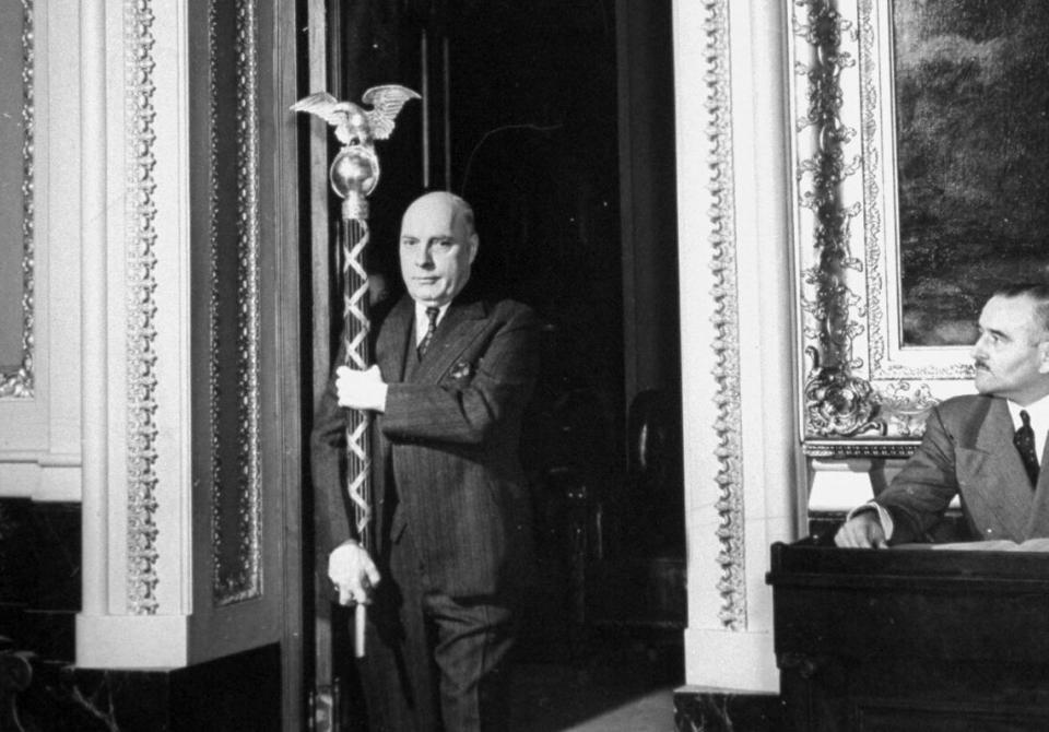 The sergeant-at-arms carries the ceremonial mace into the House of Representatives in 1941. (Photo: Thomas D. McAvoy via Getty Images)