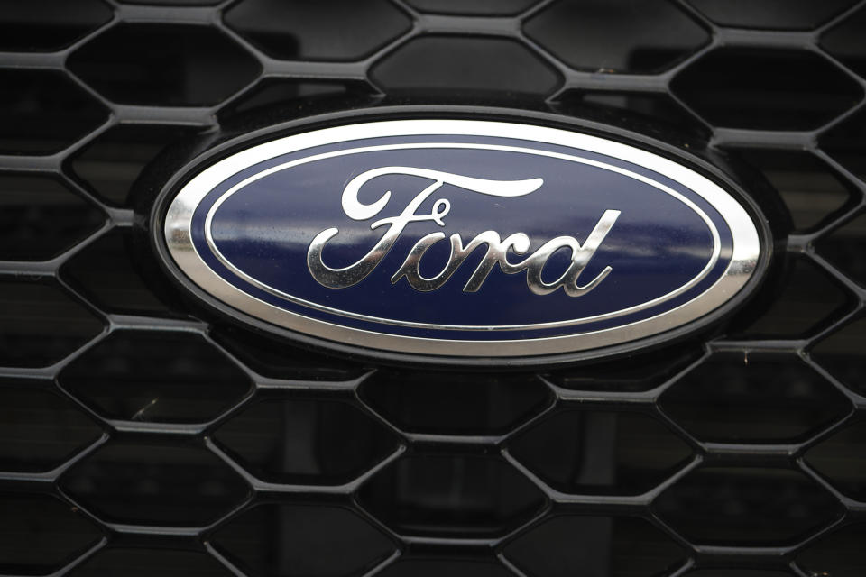 In this Sunday, Oct. 20, 2019, photograph, the company logo shones off the mesh grille of an unsold 2019 Edge ST sports-utility vehicle at a Ford dealership in Littleton, Colo. (AP Photo/David Zalubowski)