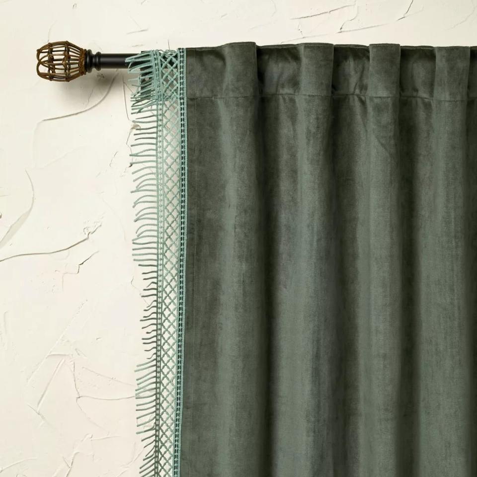 Green curtain with tassel fringe