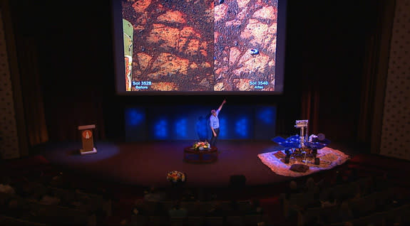 Steve Squyres, lead scientist for NASA's Mars rover Opportunity, points at a strange rock found by the rover on Jan. 8, 2014, where earlier there had been nothing, during a Jan. 16 presentation. The rock has been named "Pinnacle Island."