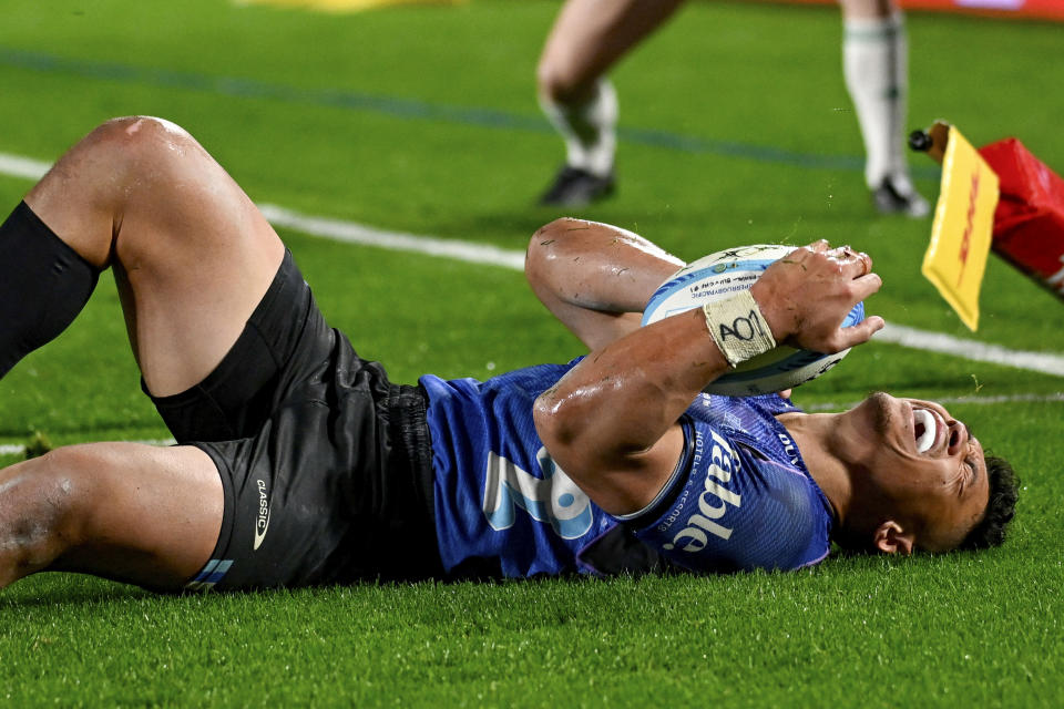 Blues winger Caleb Clarke celebrates after scoring his third try during the Super Rugby final between the Chiefs and the Blues in Auckland, New Zealand, Saturday, June 22, 2024. (Andrew Cornaga/Photosport via AP)