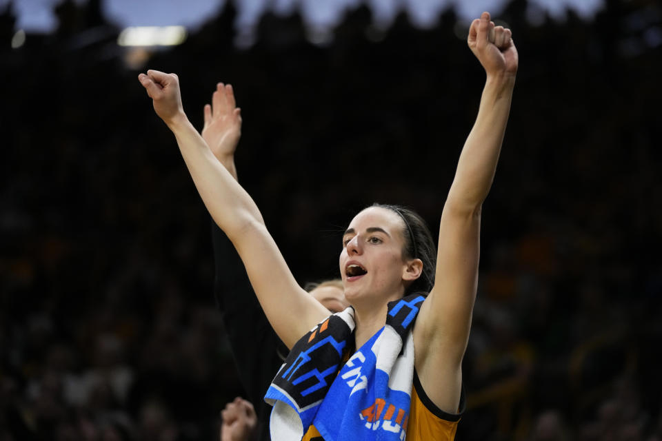 Iowa guard Caitlin Clark celebrates on the bench at the end of a first-round college basketball game against Southeastern Louisiana in the NCAA Tournament, Friday, March 17, 2023, in Iowa City, Iowa. Iowa won 95-43. (AP Photo/Charlie Neibergall)