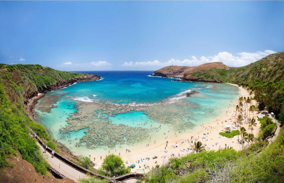 <p><strong>Hanauma Bay</strong></p><p>We couldn’t leave Hawaii out because you could be taking a road trip <em>in</em> Hawaii! Hanauma Bay is a marine embayment formed within a tuff ring along the southeast coast of <a href="https://www.gohawaii.com/islands/oahu" rel="nofollow noopener" target="_blank" data-ylk="slk:O’ahu;elm:context_link;itc:0;sec:content-canvas" class="link ">O’ahu</a>. Explore the reefs, swim in the crystal blue waters and take in the greenery.</p>