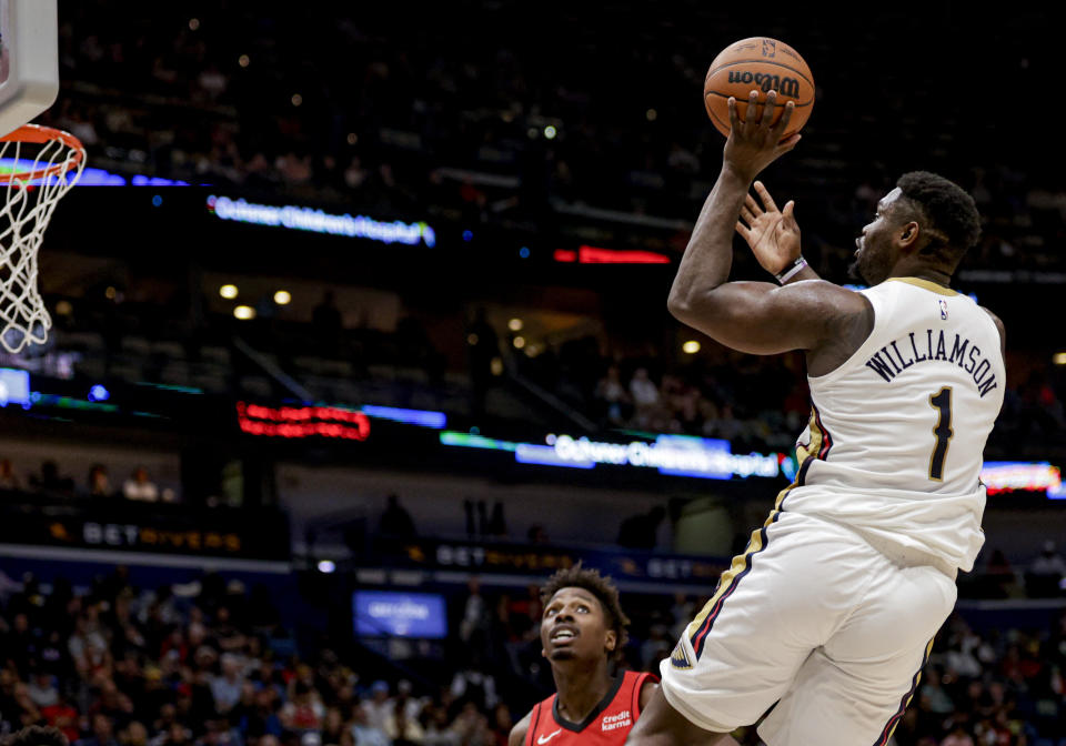 New Orleans Pelicans forward Zion Williamson (1) shoots over Houston Rockets forward Jae'Sean Tate during the second half of an NBA basketball game in New Orleans, Thursday, Feb. 22, 2024. (AP Photo/Derick Hingle)