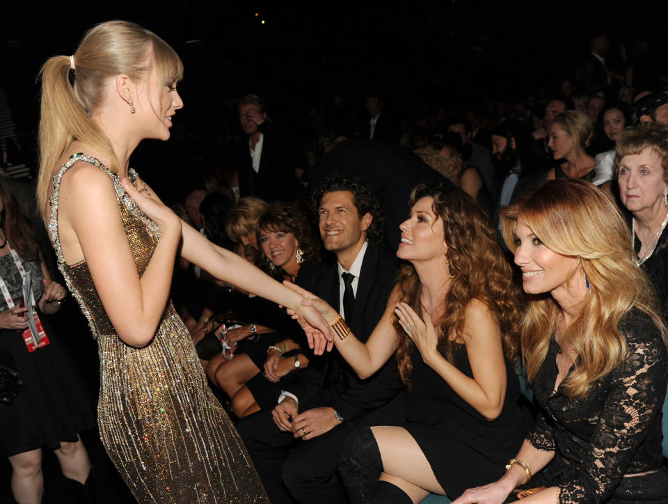 Taylor and Shania holding hands