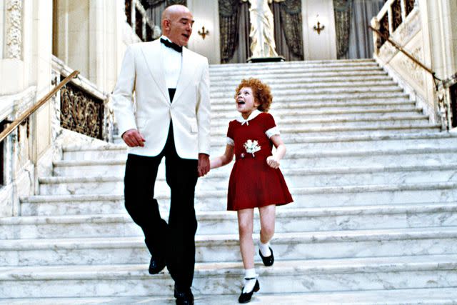 <p>Courtesy Everett Collection</p> Albert Finney and Aileen Quinn in 'Annie'