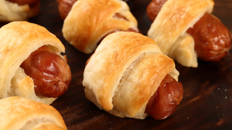 Row of pigs in a blanket