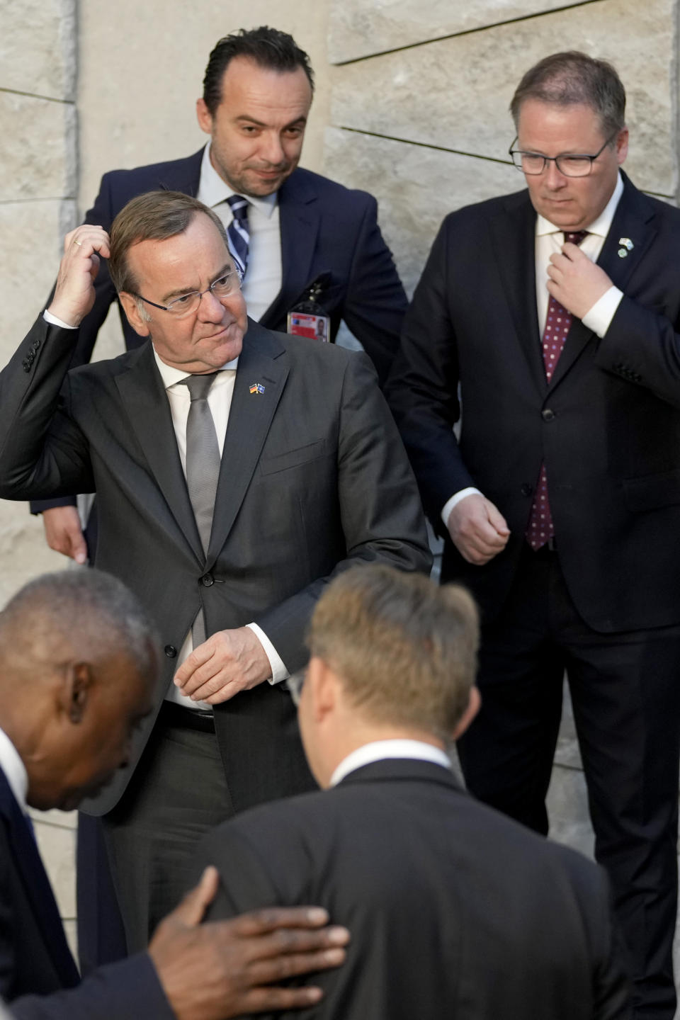 Germany's Defense Minister Boris Pistorius, left center, waits for the start of a group photo of NATO defense ministers at NATO headquarters in Brussels, Friday, June 14, 2024. (AP Photo/Virginia Mayo)