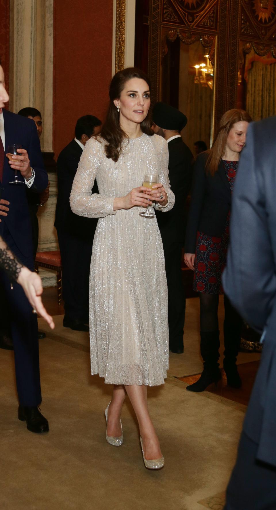 Kate Middleton wearing a white sparkly dress
