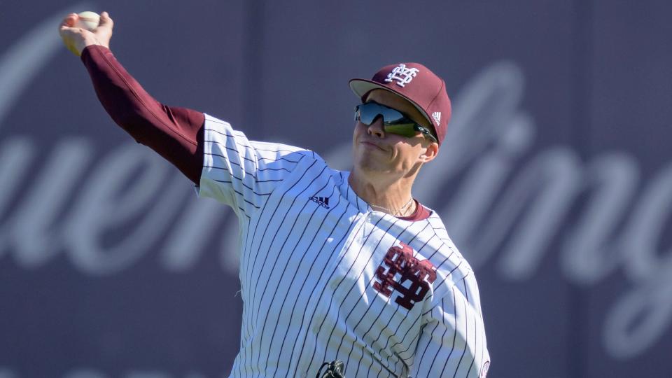 Mississippi State infielder Kellum Clark (11) throws during an NCAA baseball game on Wednesday, March 15 2023, in Biloxi, Miss. (AP Photo/Matthew Hinton)