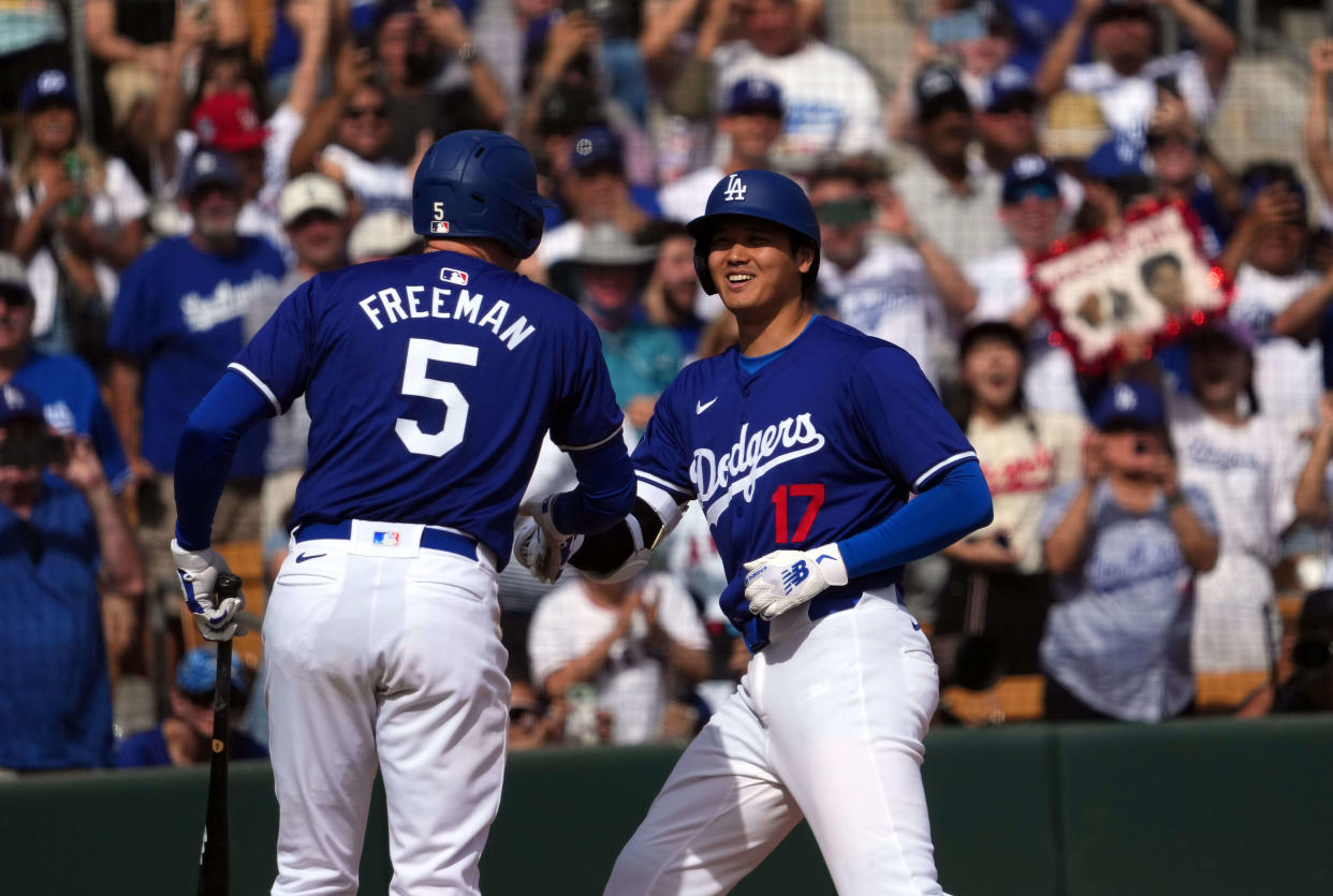 Los Angeles Dodgers DH Shohei Ohtani celebrates with first baseman Freddie Freeman after hitting a two-run home run in the fifth inning against the Chicago White Sox.