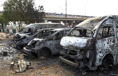 Burnt and damaged vehicles are seen at the scene of the bomb blast explosion at Nyanyan, Abuja April 14, 2014. REUTERS/Afolabi Sotunde