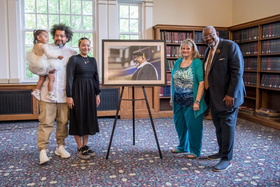 Drake University honors Wayne Ford, former state legislator and founder of the nonprofit social services agency Urban Dreams, on May 19, 2022, with the unveiling of his official portrait. From left are Ford's son, Ryan Ford, and his wife, Renee Airo-Ford, and their daughter, Faven Ford; Linda Ford, Wayne Ford's former wife and mother of their son; and Wayne Ford.