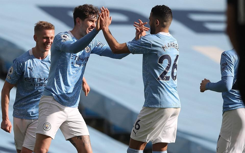 John Stones celebrates scoring for Manchester City - AFP