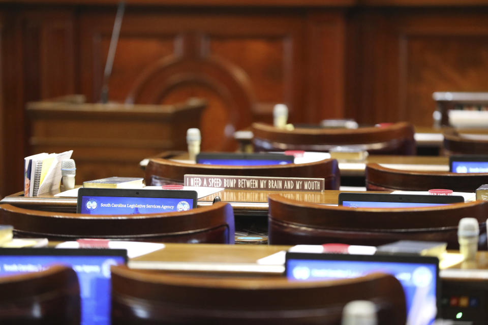 A sign is seen on the desk of the South Carolina House before a session on a total ban on abortion on Tuesday, Aug. 30, 2022, in Columbia, S.C. (AP Photo/Jeffrey Collins)