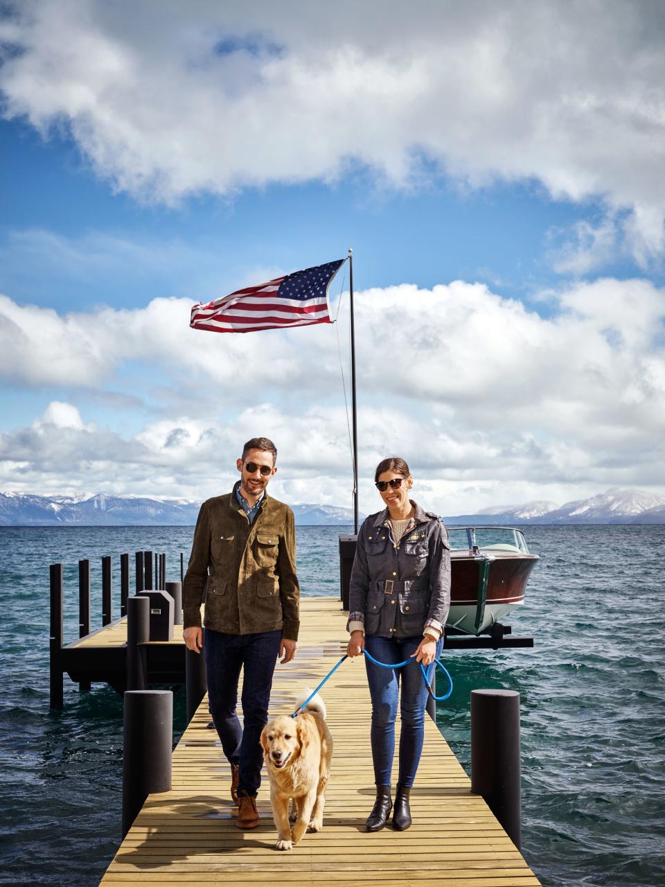 Kevin and Nicole Systrom and golden retriever Dolly on the dock