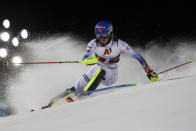 United States' Mikaela Shiffrin speeds down the course during the first run of an alpine ski women's World Cup slalom, in Schladming, Austria, Tuesday, Jan. 11, 2022. (AP Photo/Marco Trovati)