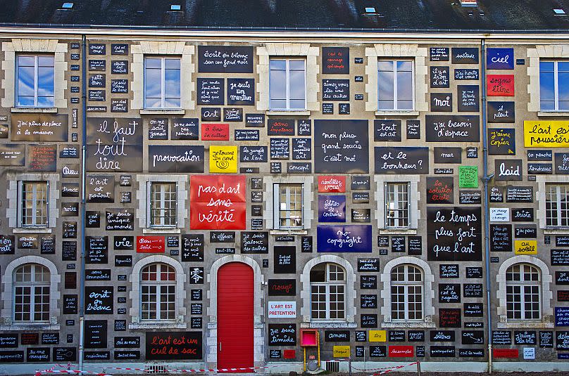 Vautier's "The `Wall of Words" was inaugurated in 1995 in Blois, France