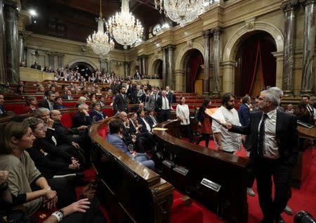 Deputies from PSC, PP, and Ciudiadanos abandon the chamber during a plenary session at the Catalan regional Parliament in Barcelona, Spain, October 27, 2017. REUTERS/Albert Gea