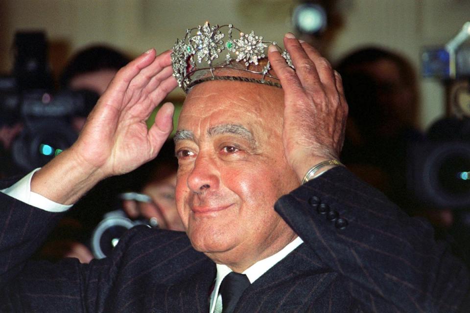 Mohamed Al Fayed donning a Victorian emerald and diamond tiara during the Harrods’ sale in 2001 (PA) (PA Wire)