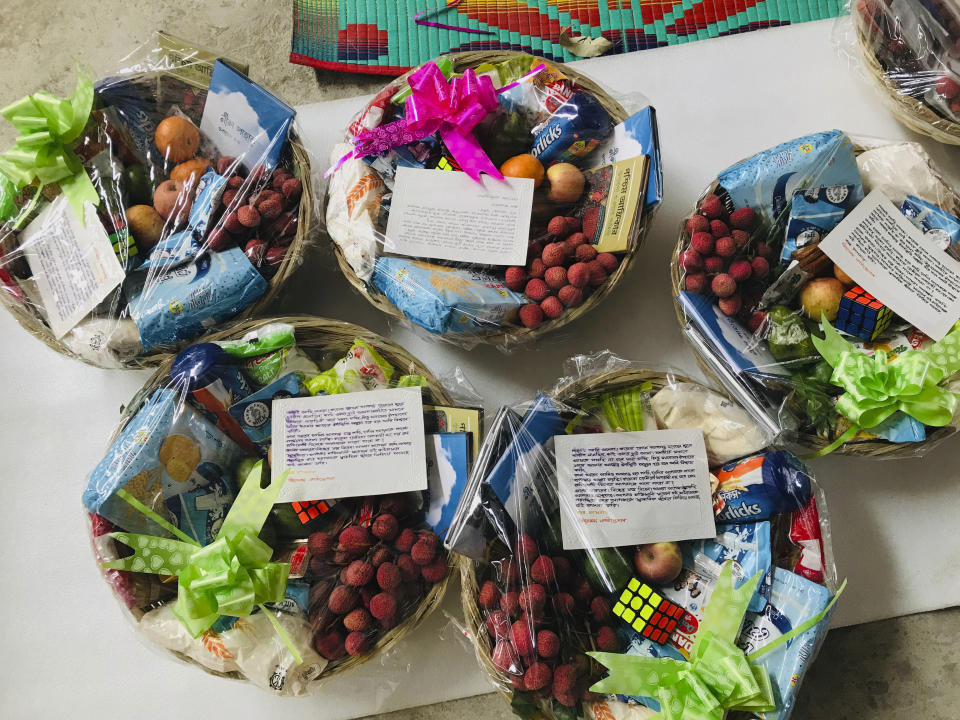 Packages meant for COVID-19 patients lay wrapped before being distributed by Bidyanondo Foundation in Dhaka, Bangladesh, Saturday, June 6, 2020. The Bangladeshi group of volunteers is providing COVID-19 patients with fruit baskets and “get well soon” cards to keep their spirits up amid reports that many patients are being ostracized by their families and neighbors. The group stepped in after disturbing news reports that a woman has been abandoned in a forest by her family after she developed coronavirus symptoms. (AP Photo/Al-emrun Garjon)