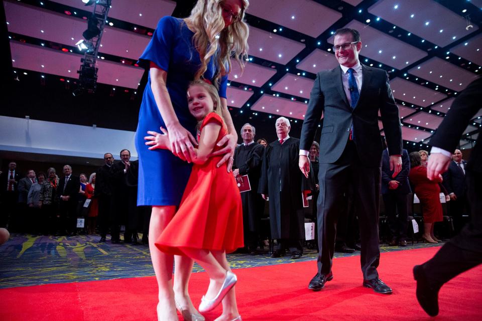 Lt. Gov. Adam Gregg and his family make their way to their seats at the start of the Inauguration Ceremony for Gregg and Gov. Kim Reynolds on Friday, Jan. 18, 2019, in Des Moines. 