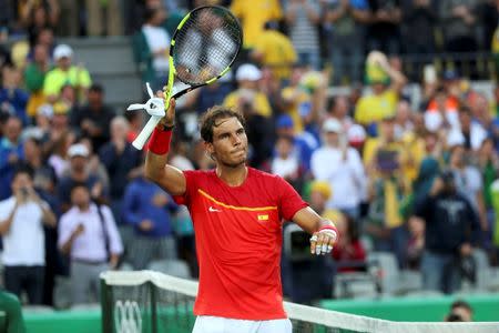 2016 Rio Olympics - Tennis - Quarterfinal - Men's Singles Quarterfinals - Olympic Tennis Centre - Rio de Janeiro, Brazil - 12/08/2016. Rafael Nadal (ESP) of Spain celebrates after winning his match against Thomaz Bellucci (BRA) of Brazil. REUTERS/Kevin Lamarque