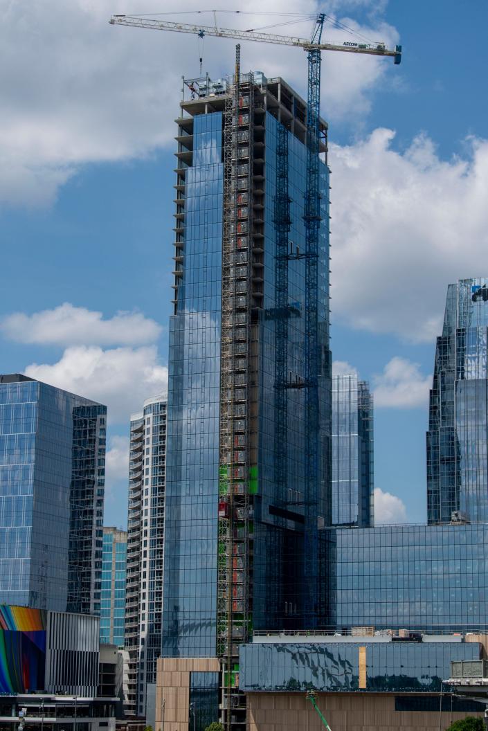 Four Seasons Nashville rises above the downtown skyline on Thursday, June 24, 2021, in Nashville, Tenn. The 40-story building will be split between condos and hotel rooms.