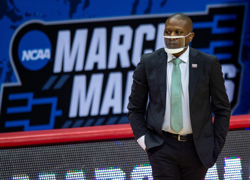Cleveland State head coach Dennis Gates watches the action on the court during the first half of a first-round game against Houston in the NCAA men's college basketball tournament March 19, 2021, at Assembly Hall in Bloomington, Ind.