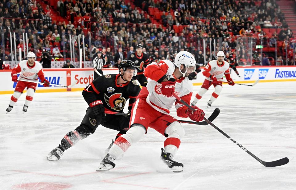 Ottawa Senators' Dominik Kubalik and Detroit Red Wings' Shayne Gostisbehere vie for the puck during the NHL Global Series 2023 in the Avicii Arena in Stockholm, Sweden, on November 16, 2023.