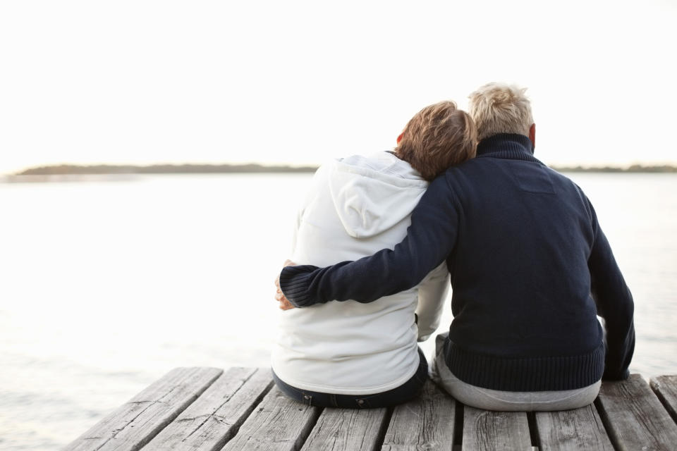 older couple sitting on a dock