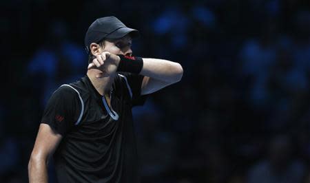 Tomas Berdych of the Czech Republic reacts during his men's singles tennis match against Stanislas Wawrinka of Switzerland at the ATP World Tour Finals at the O2 Arena in London November 4, 2013. REUTERS/Suzanne Plunkett