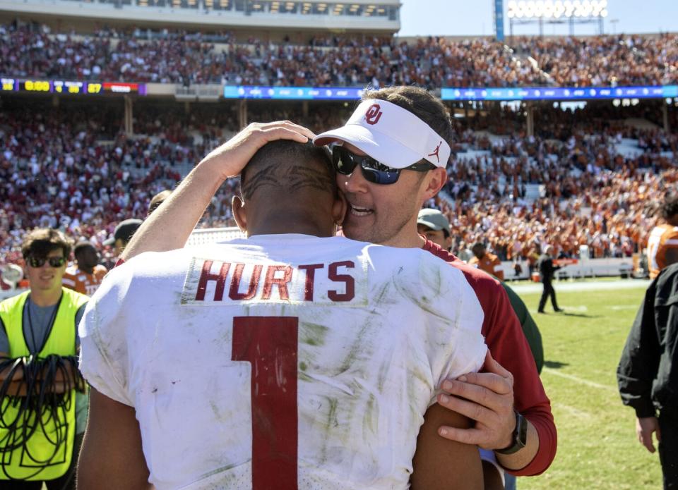 Oklahoma coach Lincoln Riley congratulates quarterback Jalen Hurts after beating Texas on Oct. 12, 2019