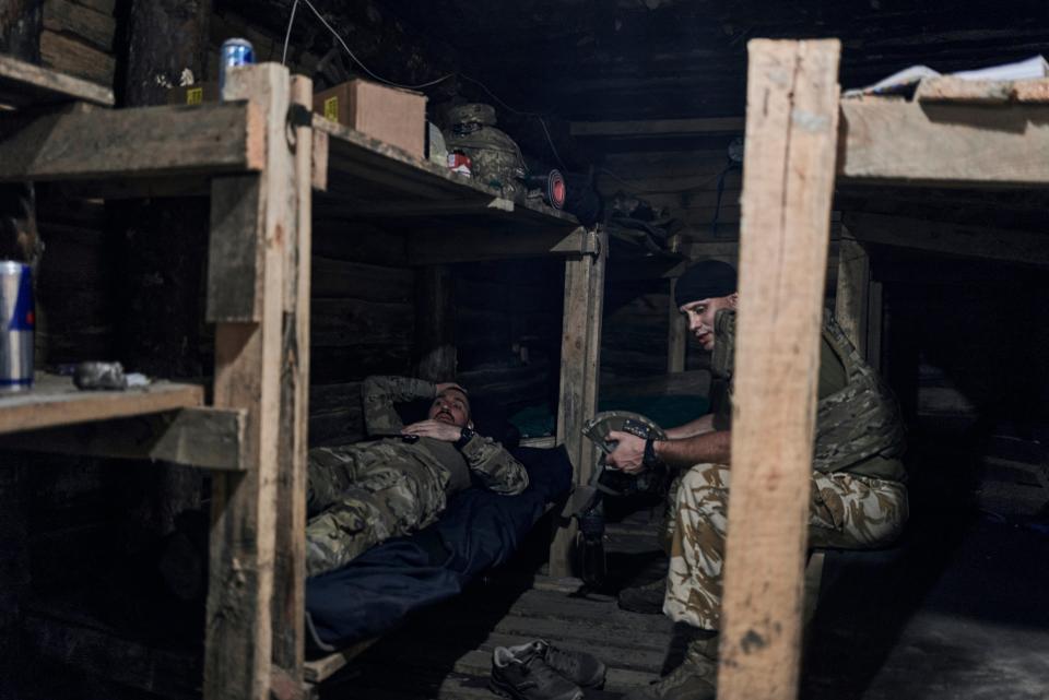 Ukrainian soldiers rest in a shelter at the front line near Bakhmut, Donetsk region (AP)