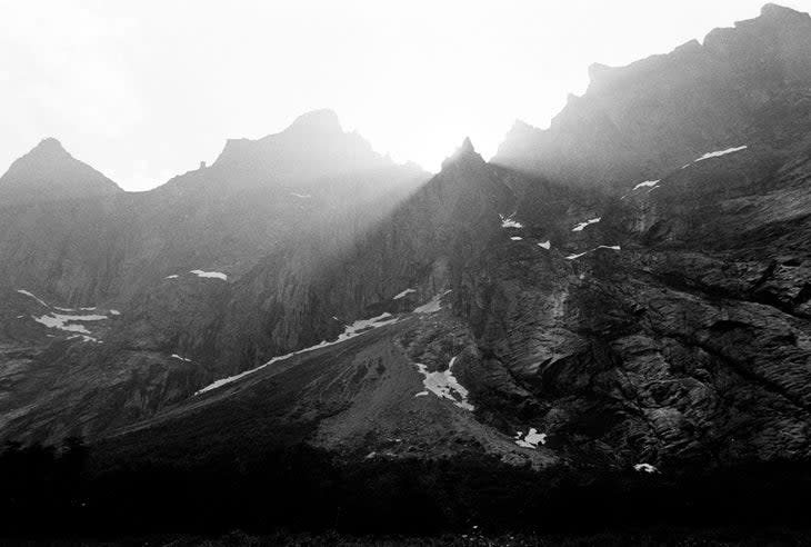 <span class="article__caption">The Troll Wall from the road leading to Andalsnes. Stabben Pinnacle (aka The Castle), the site of Carl Boenish's fatal jump, is clearly visible rearing from the upper left ridgeline.</span> (Photo: Ian Gordon)