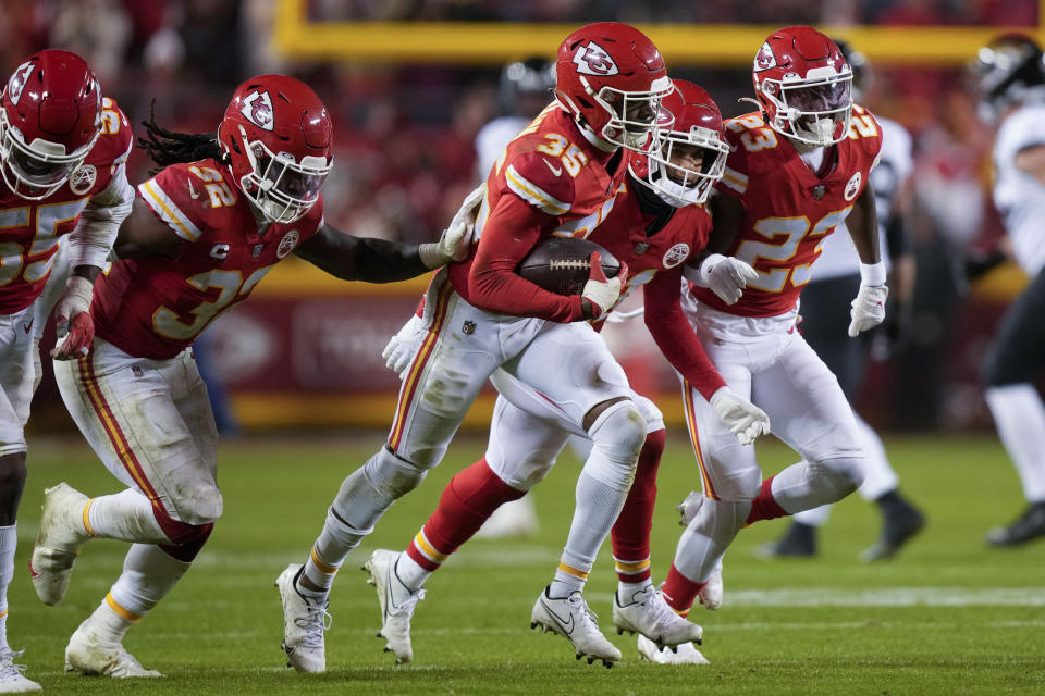 Kansas City Chiefs cornerback Jaylen Watson (35) celebrates his interception against the Jacksonville Jaguars during the second half of an NFL divisional round playoff football game, Saturday, Jan. 21, 2023, in Kansas City, Mo. The Kansas City Chiefs won 27-20. (AP Photo/Charlie Riedel)