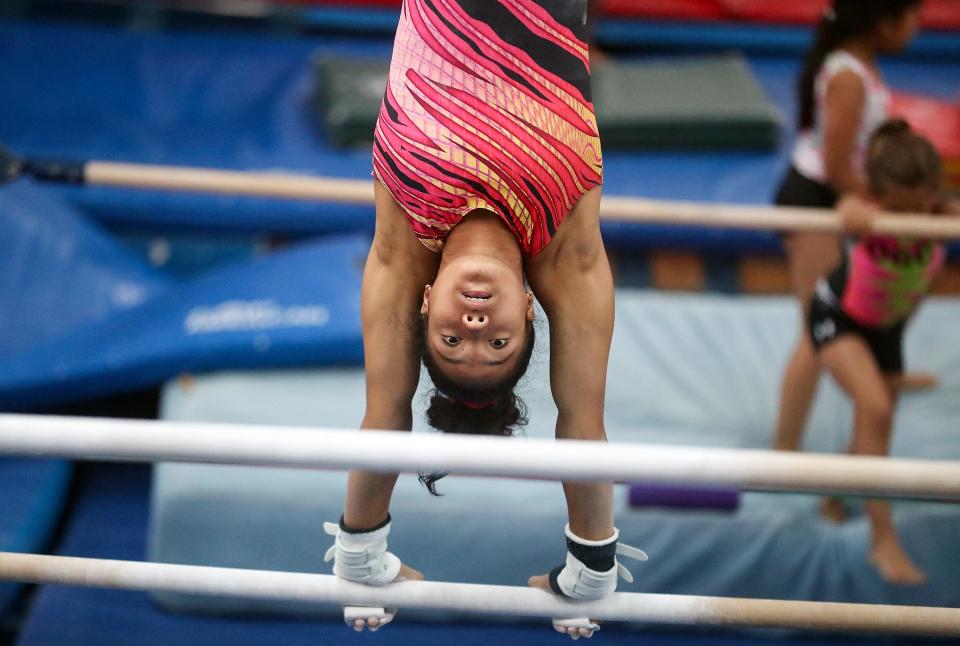 Gymnast Mya Wiley practices on the bars at the Olympic Gymnastics Center in Silverdale on Aug. 2.