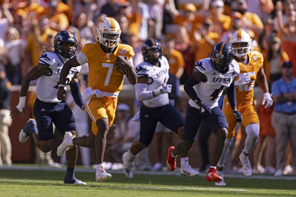 Tennessee quarterback Joe Milton III (7) outruns the UTSA defense for an 81-yard touchdown on the first play of an NCAA college football game Saturday, Sept. 23, 2023, in Knoxville, Tenn. (AP Photo/Wade Payne)