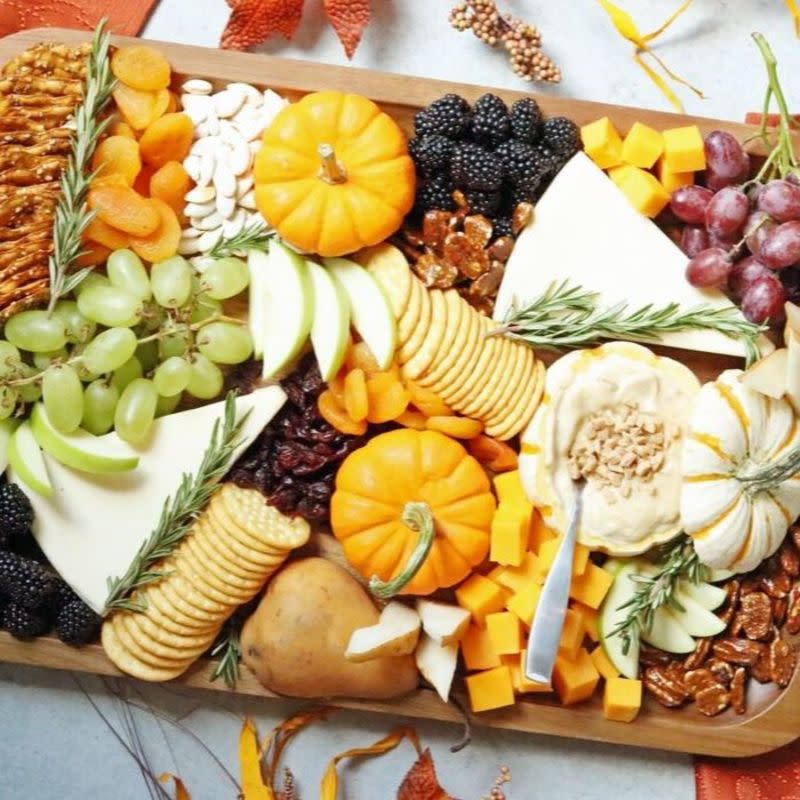 <p>Passion for Savings</p><p>Serve up this Thanksgiving snack board at your holiday gatherings this year. A sweet fruit dip inside a pumpkin, and tons of snack board fillers to dip, nibble and enjoy. This is a fantastic sweet and savory appetizer board that will give your guests a wonderful snacking board.</p><p><strong>Get the recipe: <a href="https://www.passionforsavings.com/thanksgiving-snack-board/" rel="nofollow noopener" target="_blank" data-ylk="slk:Thanksgiving Snack Board;elm:context_link;itc:0;sec:content-canvas" class="link ">Thanksgiving Snack Board</a></strong></p>