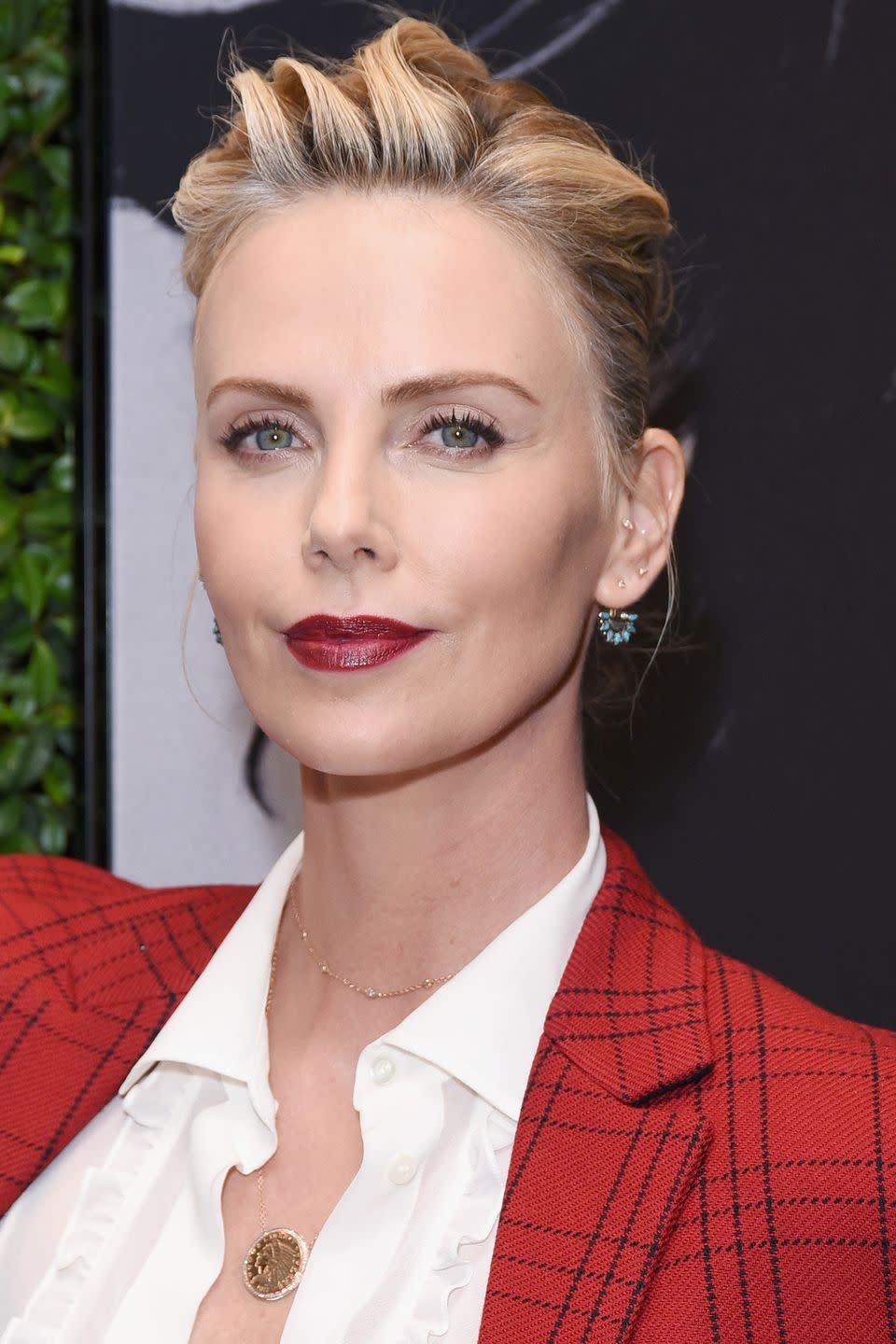 <p>Charlize Theron always looks sophisticated on the red carpet, mainly because she has perfected a classic make-up look comprising of long, fluttery lashes and dark red lipstick. You can easily recreate it using Hourglass' <a rel="nofollow noopener" href="https://www.feelunique.com/p/Hourglass-Caution-Extreme-Lash-Mascara-87g?" target="_blank" data-ylk="slk:Caution Extreme Lash Mascara;elm:context_link;itc:0;sec:content-canvas" class="link ">Caution Extreme Lash Mascara</a> and Dior's <a rel="nofollow noopener" href="http://www.selfridges.com/GB/en/cat/dior-rouge-dior-ultra-rouge_359-84011246-ULTRAROUGE/?" target="_blank" data-ylk="slk:Rouge Dior Ultra Rouge Lipstick in Ultra Poison;elm:context_link;itc:0;sec:content-canvas" class="link ">Rouge Dior Ultra Rouge Lipstick in Ultra Poison</a>. </p>