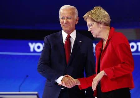 Former Vice President Biden shakes hands with Senator Warren at the start of the 2020 Democratic U.S. presidential debate in Houston, Texas, U.S.