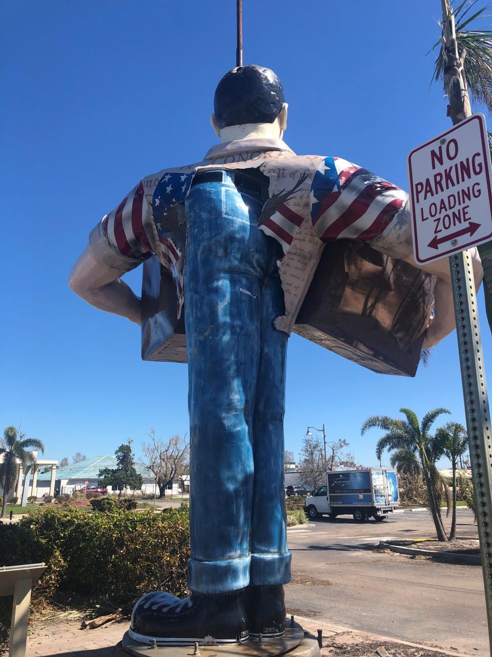 Cape Coral's popular Big John statue was damaged during Hurricane Ian. The storm's winds twisted its fiberglass torso and broke it free of its metal support structure. Now a metal pole juts from Big John's head and the torso has slid around the statue's blue-jeaned bottom.