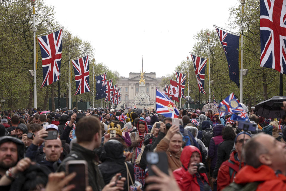 Crowds gather to watch the Coronation of King Charles III and Queen Camilla in London, Saturday, May 6, 2023. (Richard Heathcote, Pool via AP)