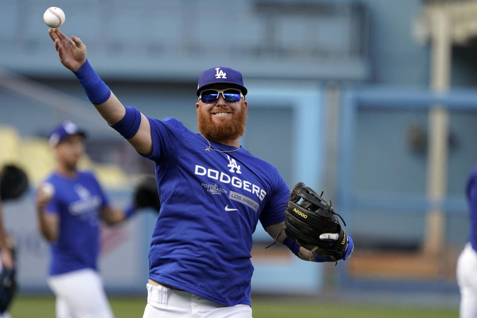 Los Angeles Dodgers third baseman Justin Turner warms up during a workout in preparation for Game 1 of a baseball NL Division Series, Friday, Oct. 7, 2022, in Los Angeles. The Dodgers will play the winner of the wild-card series between the San Diego Padres and the New York Mets. (AP Photo/Marcio Jose Sanchez)