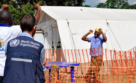 FILE PHOTO: Esperance Nzavaki and health workers celebrate news of her Ebola cure at The Alliance for International Medical Action (ALIMA) treatment center in Beni, North Kivu province of the Democratic Republic of Congo September 6, 2018. REUTERS/Fiston Mahamba/File Photo