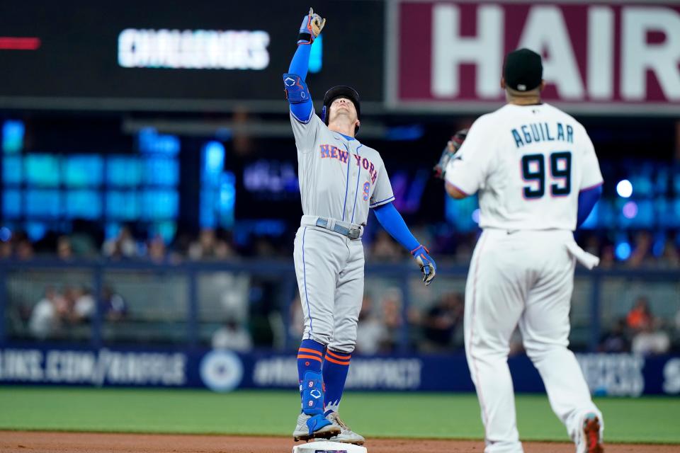 New York Mets' Brandon Nimmo reacts after hitting a double during the first inning of a baseball game against the Miami Marlins, Sunday, June 26, 2022, in Miami.