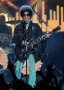 Prince at the billboard music awards in a tasseled leather jacket, and emerald green leggings.